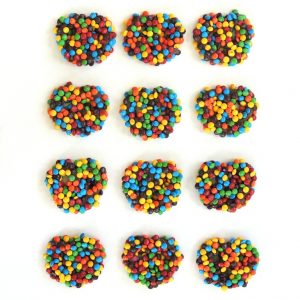 Buy 12 individually wrapped handmade Chocolate Covered Pretzels with Famous Chocolate Candy Coated Pieces for $32.50.